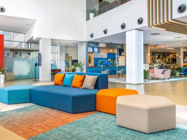 Spacious Holiday Inn Žilina lobby with colourful seating.