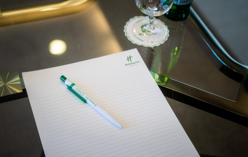 Omega meeting room notepad and refreshments.