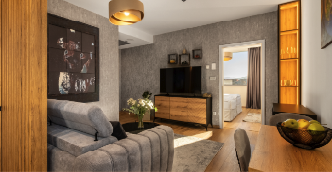 Television and seating area in the Junior Suite at Holiday Inn Žilina.
