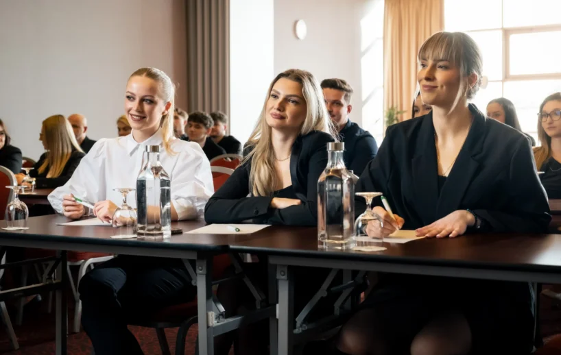 Audience attending a presentation in the Century room.