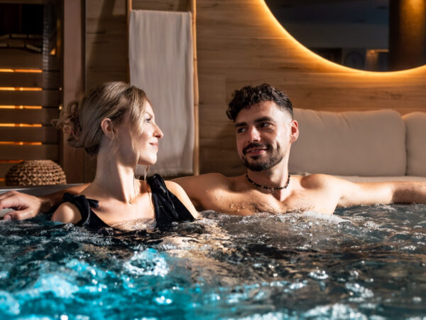 Couple relaxing in the hot tub.